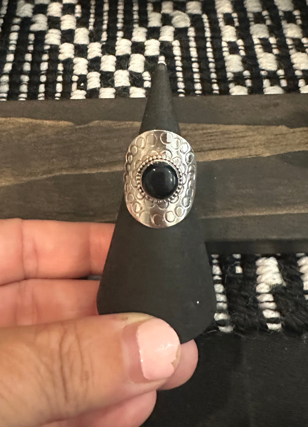 Onyx encircled by silver ring